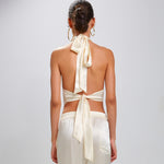 Back view: The Devi Ivory halter tie back 100% Silk Charmeuse top with pointed raw edge