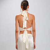 Back view: The Devi Ivory halter tie back 100% Silk Charmeuse top with pointed raw edge